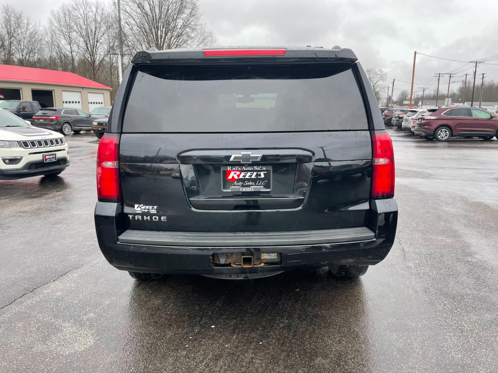 2015 Black /Black Chevrolet Tahoe LS 4WD (1GNSKAEC8FR) with an 5.3L V8 OHV 16V engine, 6-Speed Automatic transmission, located at 547 E. Main St., Orwell, OH, 44076, (440) 437-5893, 41.535435, -80.847855 - This 2015 Chevrolet Tahoe LS 4WD is a versatile and robust full-size SUV that offers a range of comfort and utility features, appealing to families and those needing a capable vehicle for towing and outdoor adventures. Equipped with Tri-Zone Automatic Climate Control, Power Front Seats, and Rain Sen - Photo #10